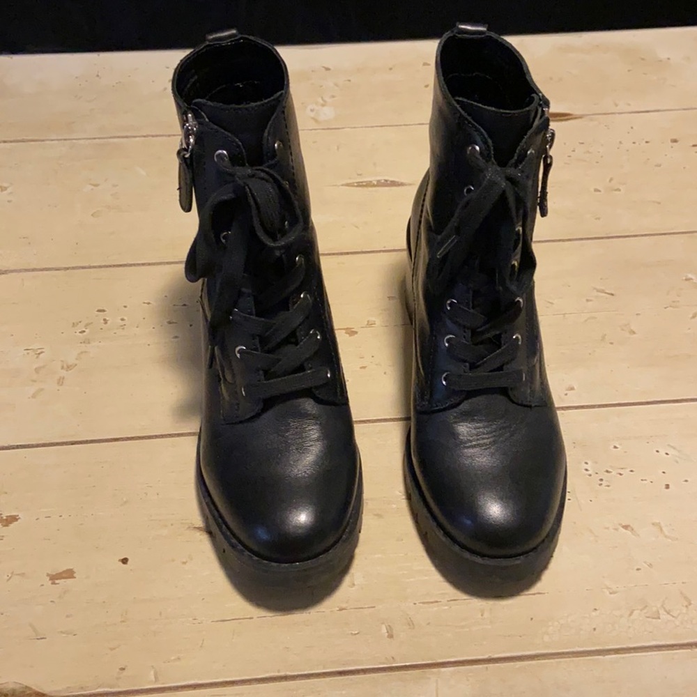 Black leather heeled combat boots